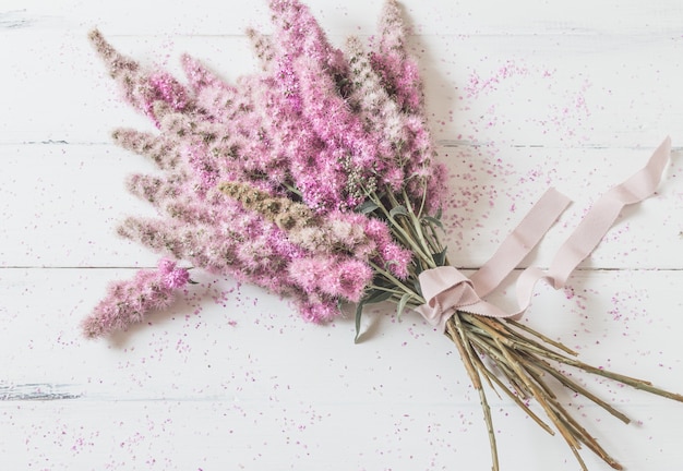 Bouquet of pink flowers on white 