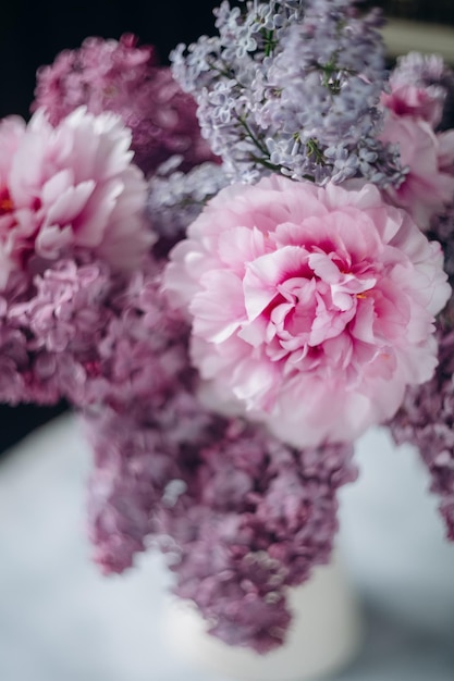 A bouquet of pink flowers with a white background