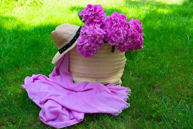 Bouquet of pink hydrangea on green grass