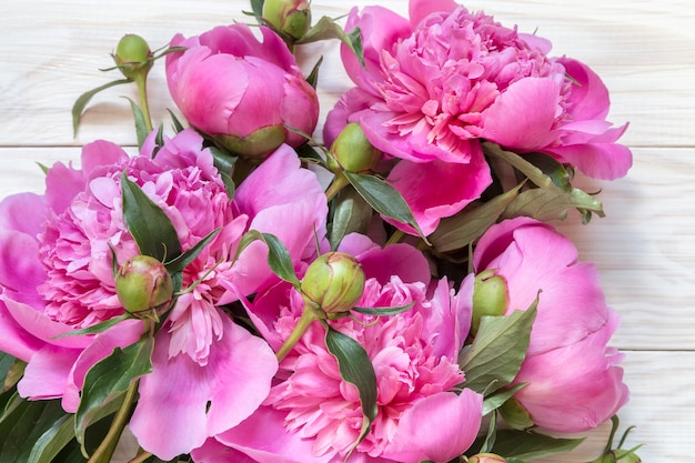 Bouquet of pink peonies  on a wooden table. Gift Valentine's Day.