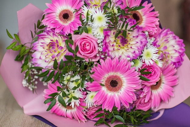 Bouquet of pink roses chrysanthemums and gerberas close up