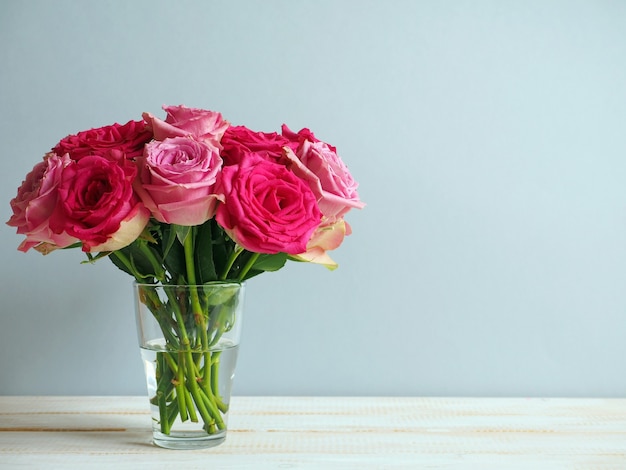 Bouquet of pink roses in glass