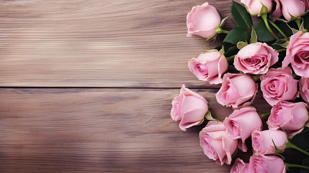 Photo a bouquet of pink roses on wooden background copy space