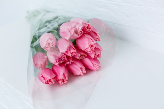 bouquet of pink tulips on a white background