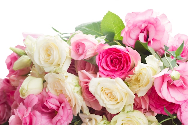 Bouquet of pink and white fresh roses and eustoma flowers close up isolated