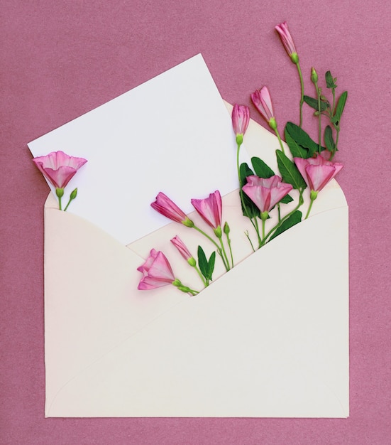 Bouquet of pink wildflowers in an envelope  Greeting card with place for design