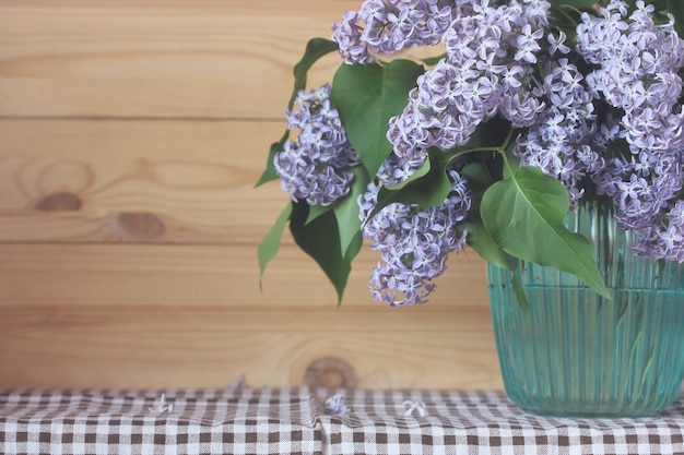 Bouquet of purple lilac in a vase. 