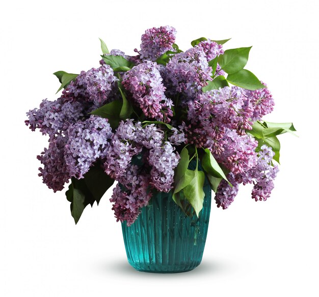 Bouquet of purple lilacs in blue glass vase