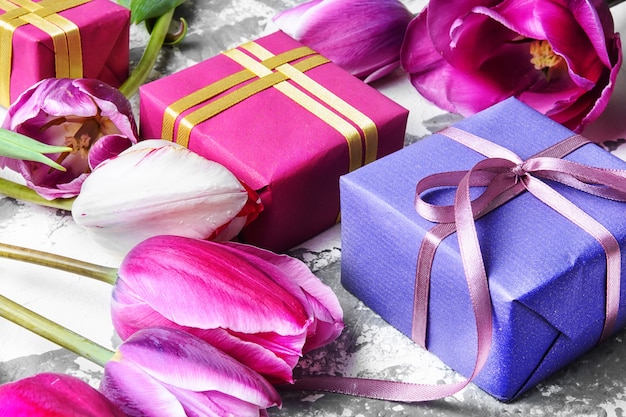 Bouquet of purple tulips and gift box