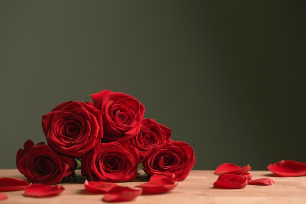 bouquet of red roses on green background