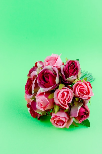 Bouquet of roses on a green