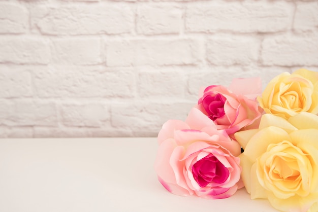 Bouquet of roses on a white desk