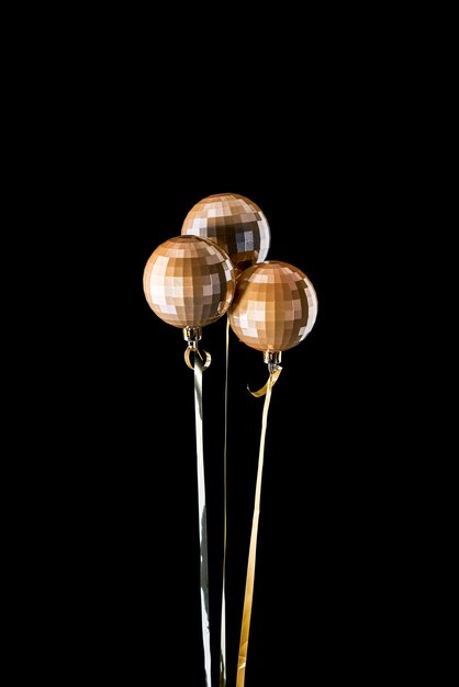 Bouquet of shiny Christmas balls on a black background