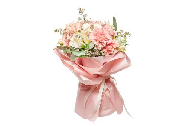 Premium Photo  Bouquet of soft pink flowers in pink wrapping paper in  woman hands isolated on white surface