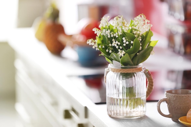 Bouquet of spring flowers in kitchen