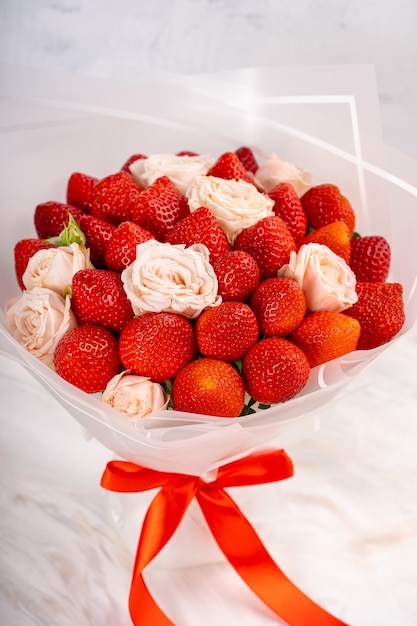 Bouquet of strawberries and roses.