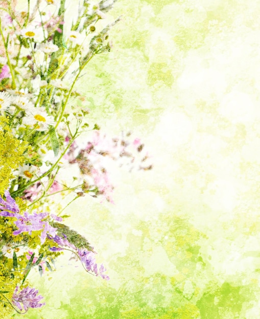 Bouquet of summer meadow flowers with bokeh and copy space floral grunge textured background