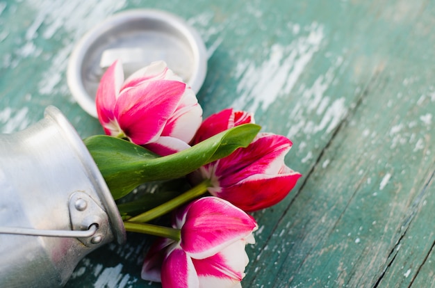 Bouquet of tulips in an aluminum can.