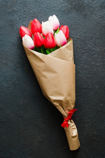 Bouquet of tulips on dark background for Valentine's, Women's or Mother's day.