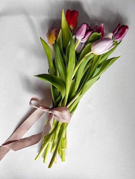 Photo bouquet of tulips on white