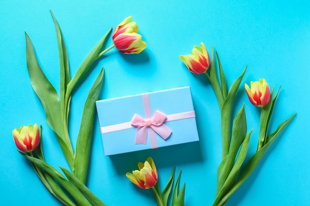 Bouquet of tulips with gift box