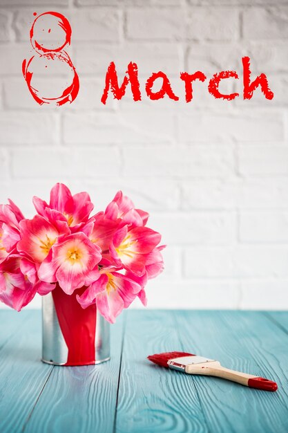 Bouquet of tulips on wood table. Woman's day. 8 March. Spring holiday and home renovation concept