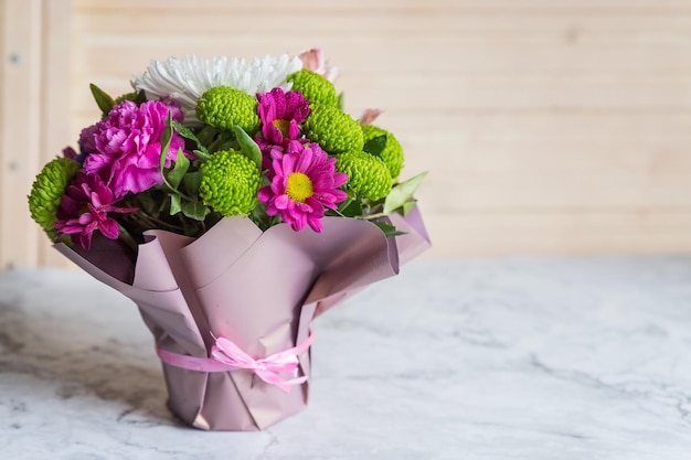 Bouquet of varied flowersbouquet of colorful chrysanthemums roses and gypsophila traditional gift