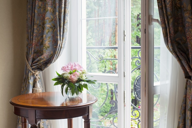 Bouquet in vintage interior on background window