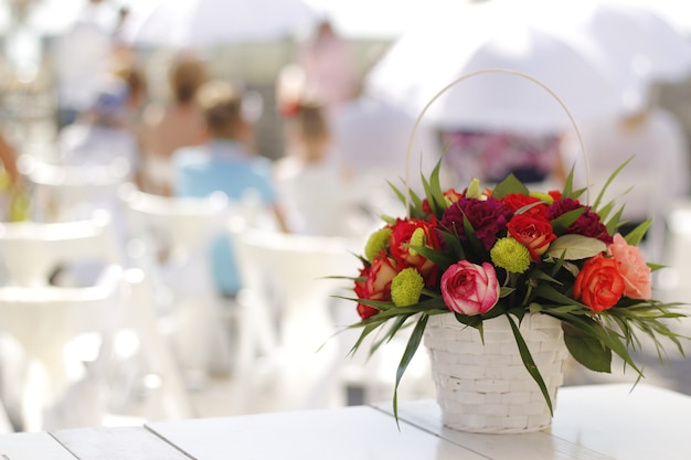 Bouquet of wedding flowers in a bucket on the table