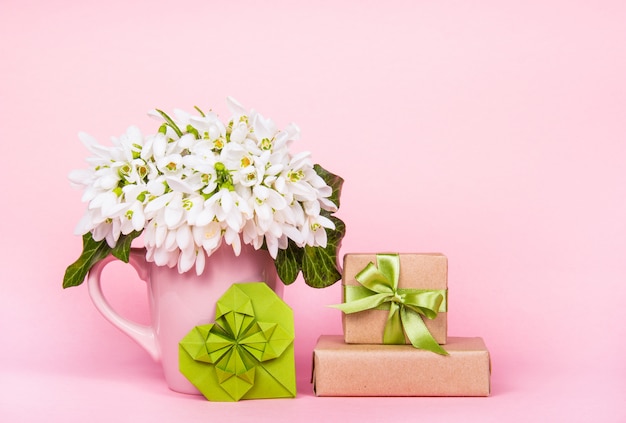 Bouquet of white flowers and gift box