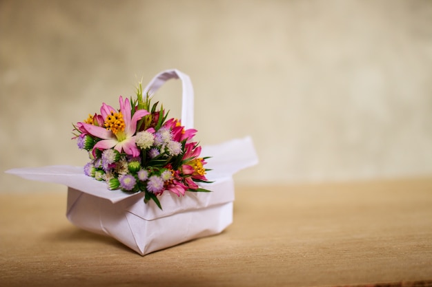Bouquet in White Paper Basket