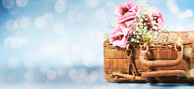 Bouquet on wicker suitcase