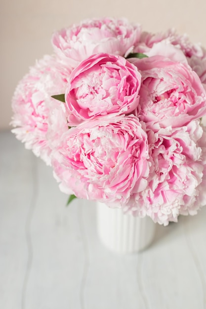 Photo bouquet with beautiful pink peonies blurred macro background