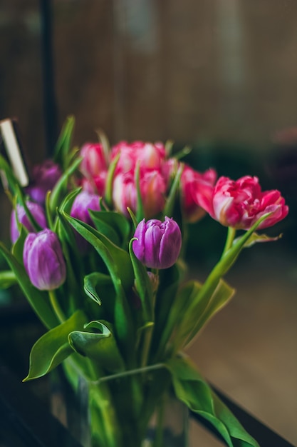 Bouquet with pink and purple tulips