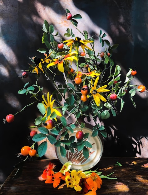 Bouquet with rosehip rudbeckia nasturtium