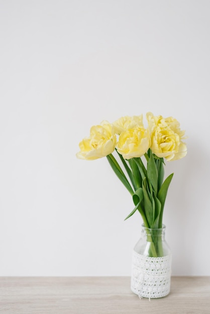 Bouquet of yellow tulips in a vase A gift for Women's Day of yellow tulip flowers yellow flowers