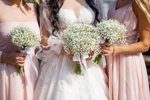 Bouquets of bridesmaids holding bouquets in the center