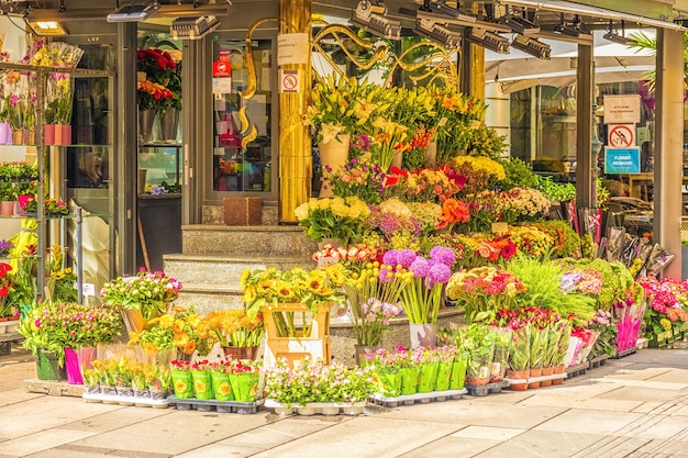 Bouquets of colorful  flowers at the entry of flower shop.