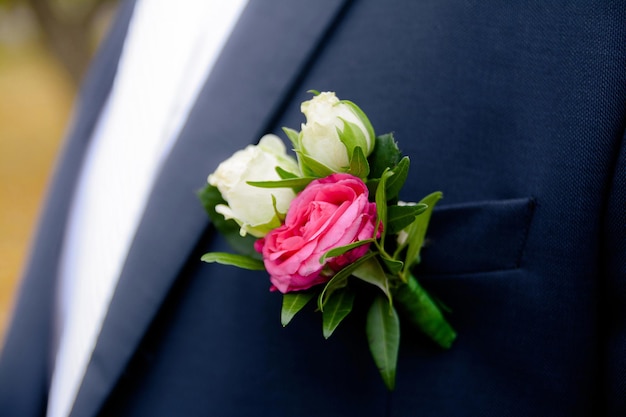 boutonniere on the grooms jacket