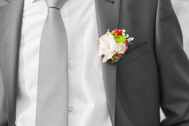 Boutonniere on suit of groom on the wedding day