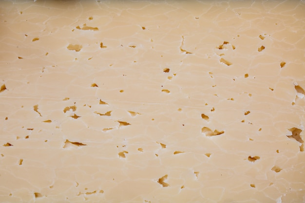 Bovenaanzicht close-up van gele kaas gerookte plak textuur