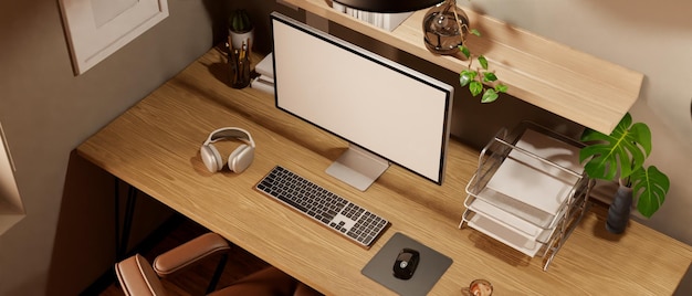 Bovenaanzicht Comfortabel en minimalistisch houten werkstation met computermodel en kantoorbenodigdheden