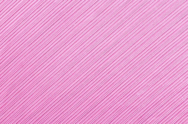 Bovenaanzicht roze getinte abstracte textiel textuur achtergrond