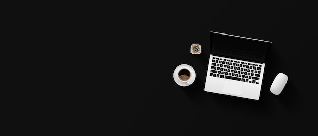 Bovenaanzicht van de werkruimte van het Bureau met koffiekopje en laptop op zwarte tafel