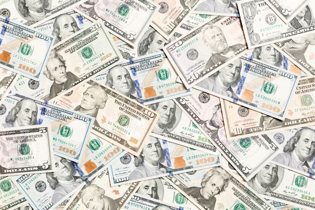 Foto bovenaanzicht van verschillende dollar cash achtergrond
