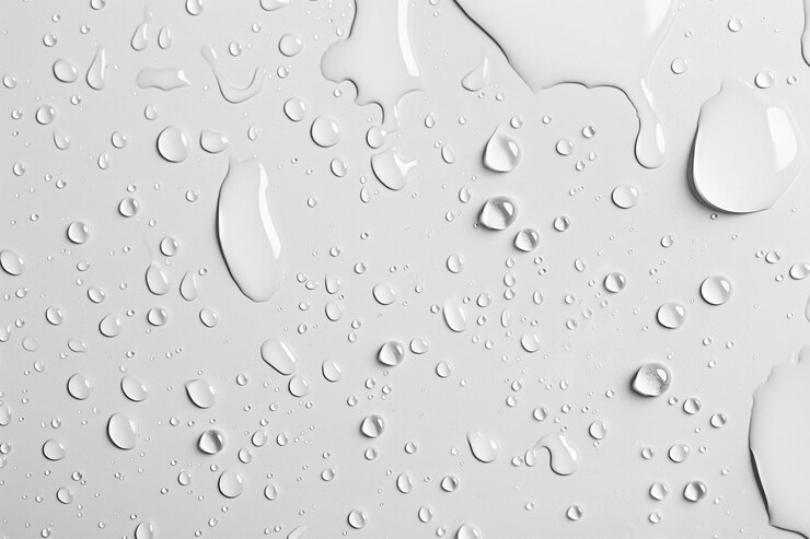Bovenbeeld Waterdruppels op een witte achtergrond