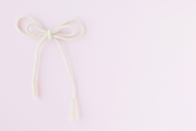 Bow rope on pink background