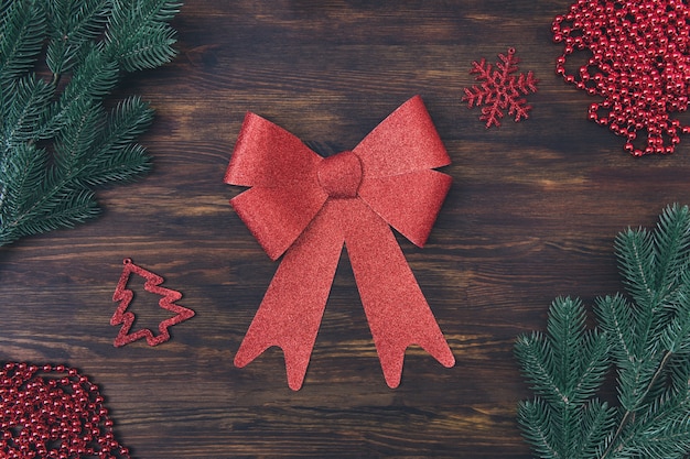 Bow on wooden table with natural branches