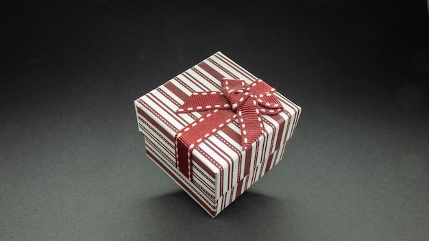 Bowed surprise gift with red bow