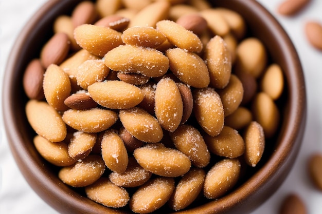 A bowl of almonds with salt on top